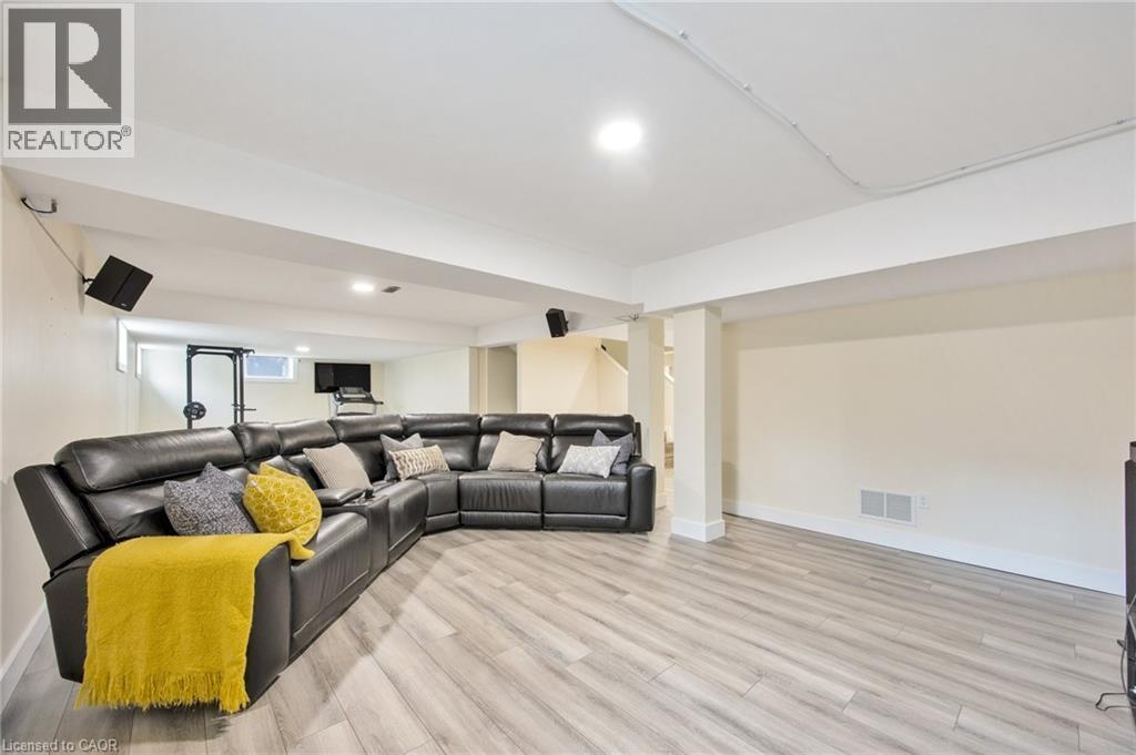 Spacious lower-level area featuring light wood-finish flooring and recessed lighting - 6 Dorothys Drive, Oro-Medonte, ON - Indoor