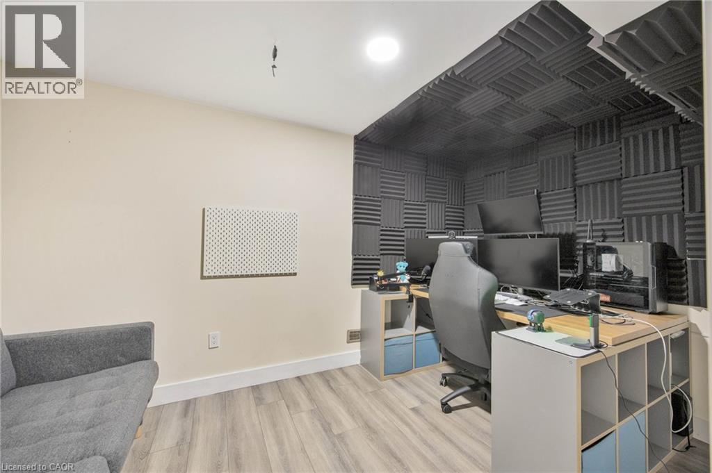 Dedicated workspace featuring acoustically treated walls and integrated shelving - 6 Dorothys Drive, Oro-Medonte, ON - Indoor Photo Showing Office