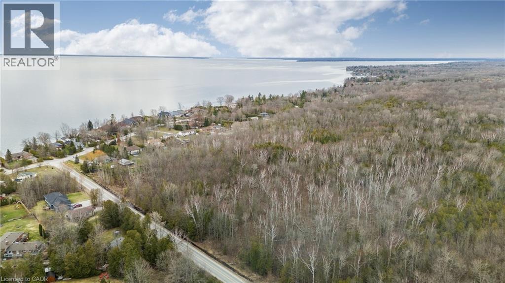 Expansive waterfront property featuring a substantial wooded area, direct water frontage, and surrounding residential properties - 6 Dorothys Drive, Oro-Medonte, ON - Outdoor With Body Of Water With View