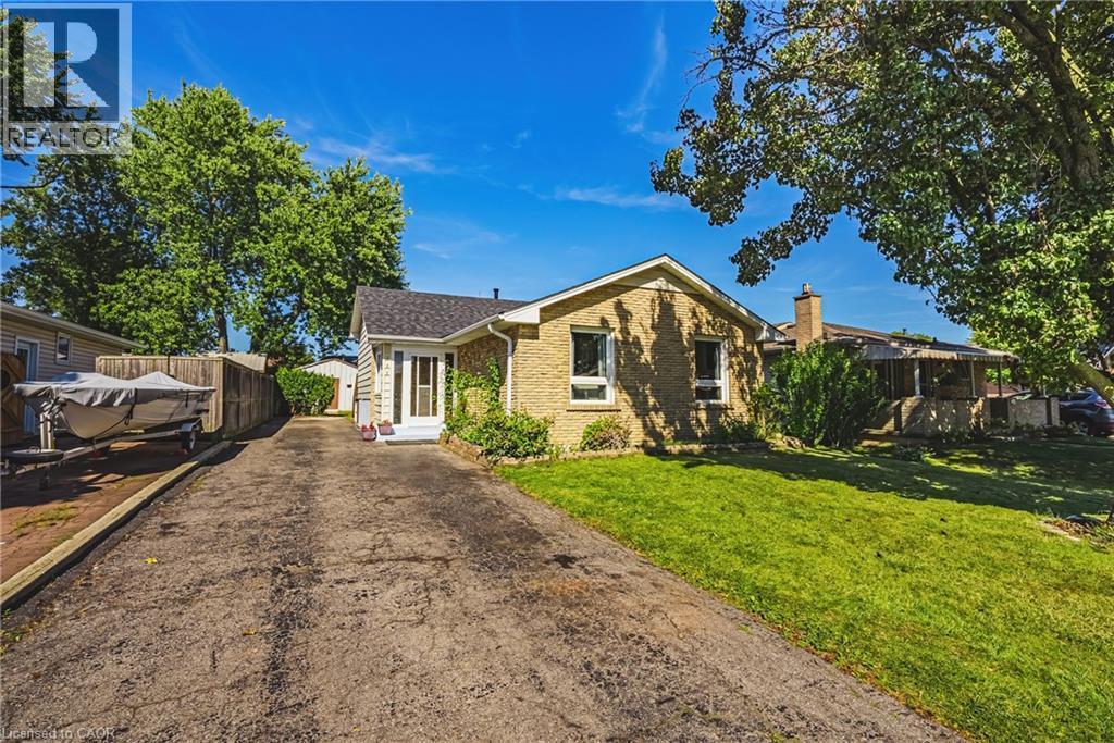 Brick exterior with a gabled roof - 235 Larch Street, Hamilton, ON - Outdoor