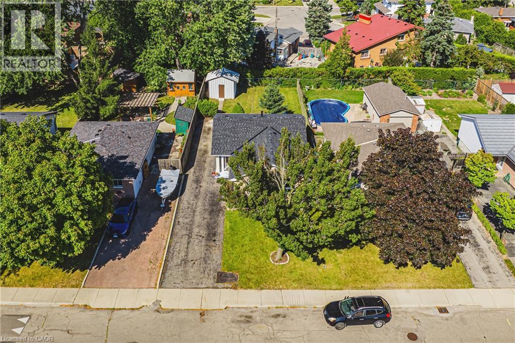 Single-story property featuring a dark-shingled roof and light-colored siding - 235 Larch Street, Hamilton, ON - Outdoor