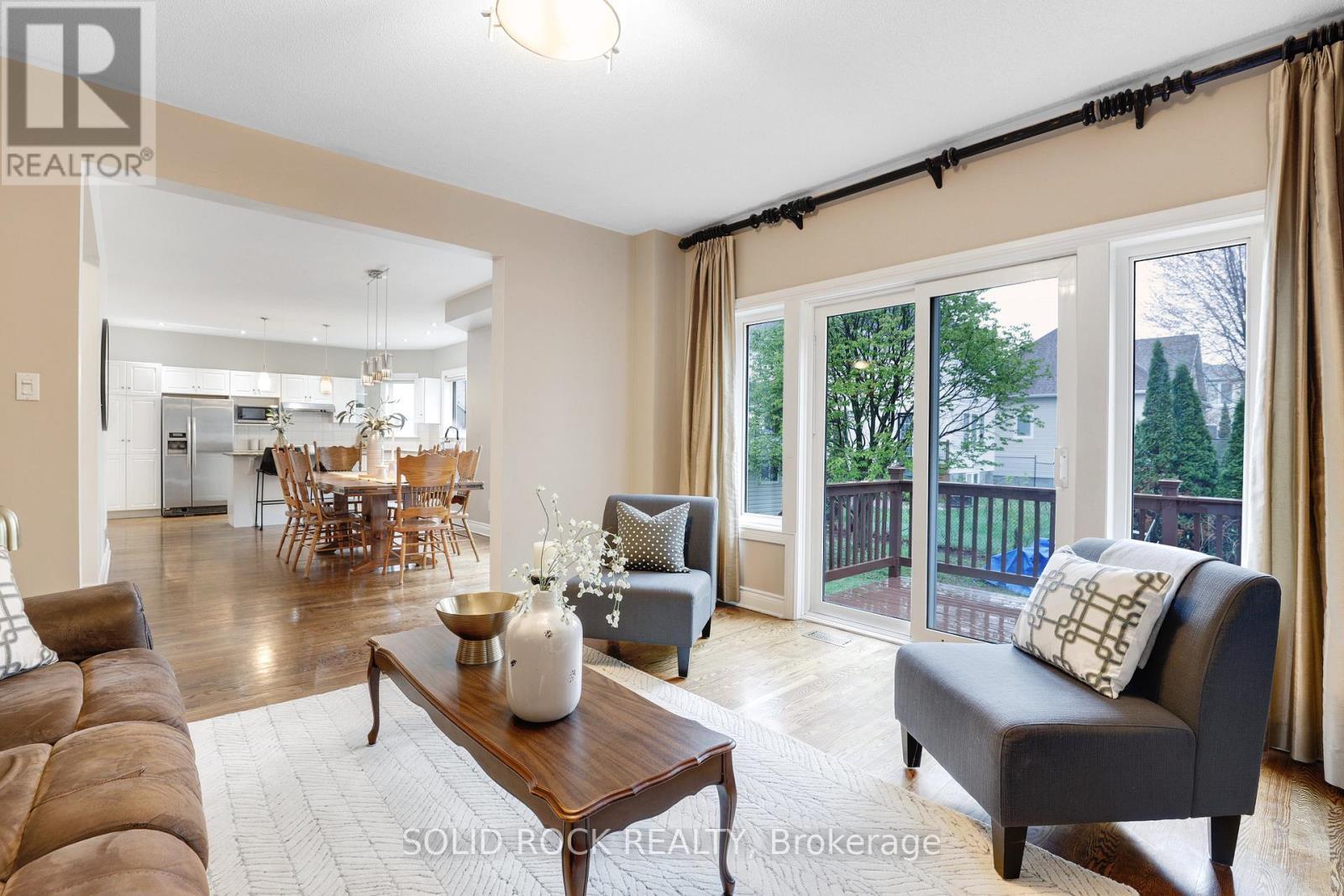 Family room open to dining room and kitchen - 45 Basswood Avenue, Ottawa, ON - Indoor Photo Showing Living Room