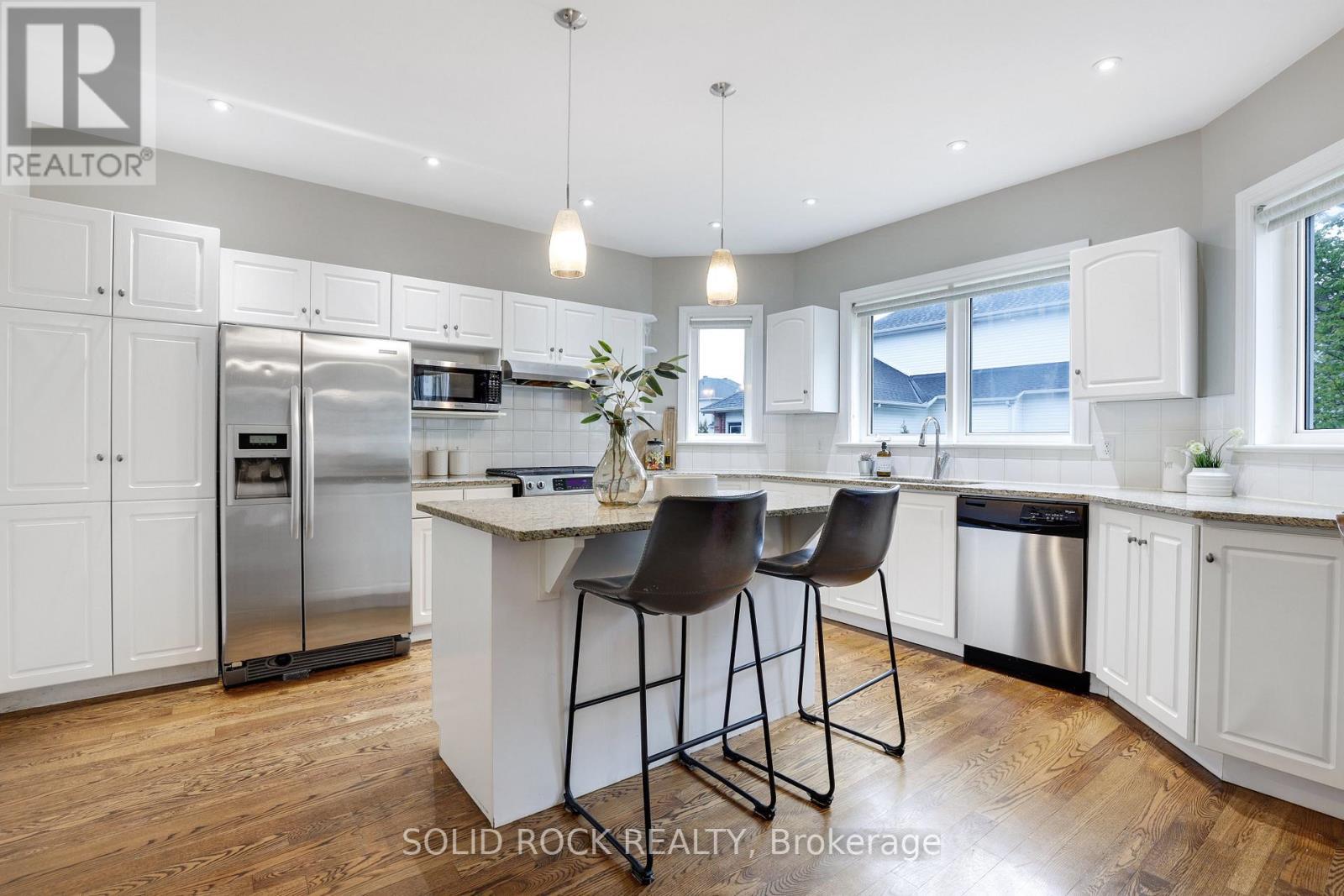 Kitchen with hardwood floors and granite counterto - 45 Basswood Avenue, Ottawa, ON - Indoor Photo Showing Kitchen With Upgraded Kitchen