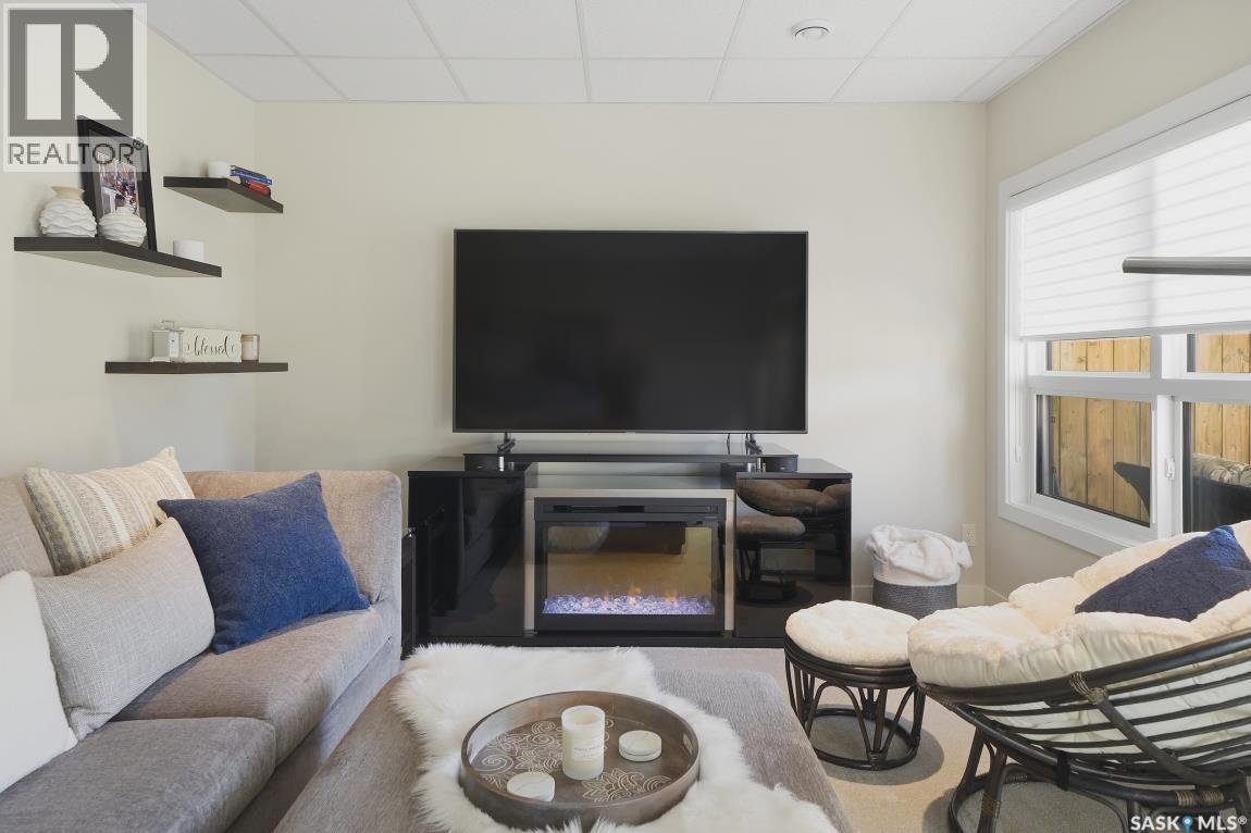 27 619 Evergreen Boulevard, Saskatoon, SK - Indoor Photo Showing Living Room With Fireplace