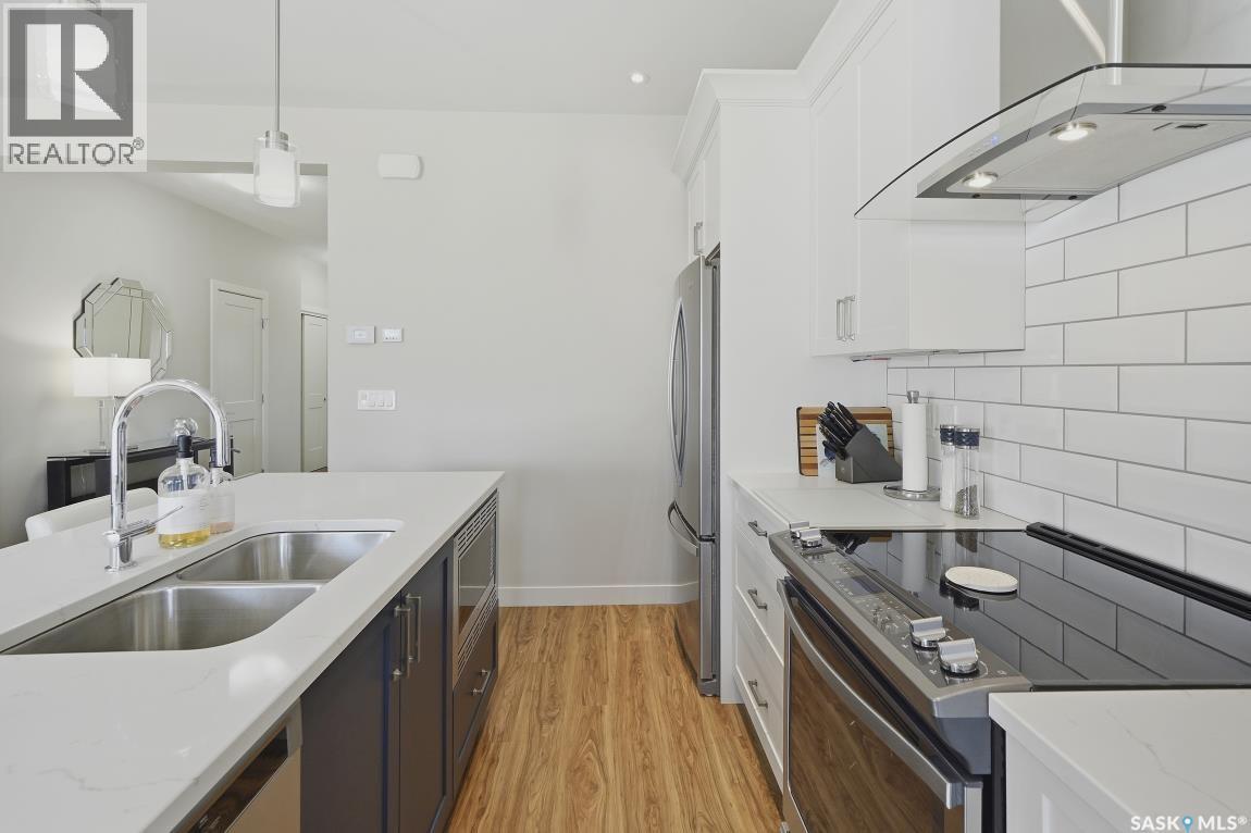 27 619 Evergreen Boulevard, Saskatoon, SK - Indoor Photo Showing Kitchen With Double Sink With Upgraded Kitchen
