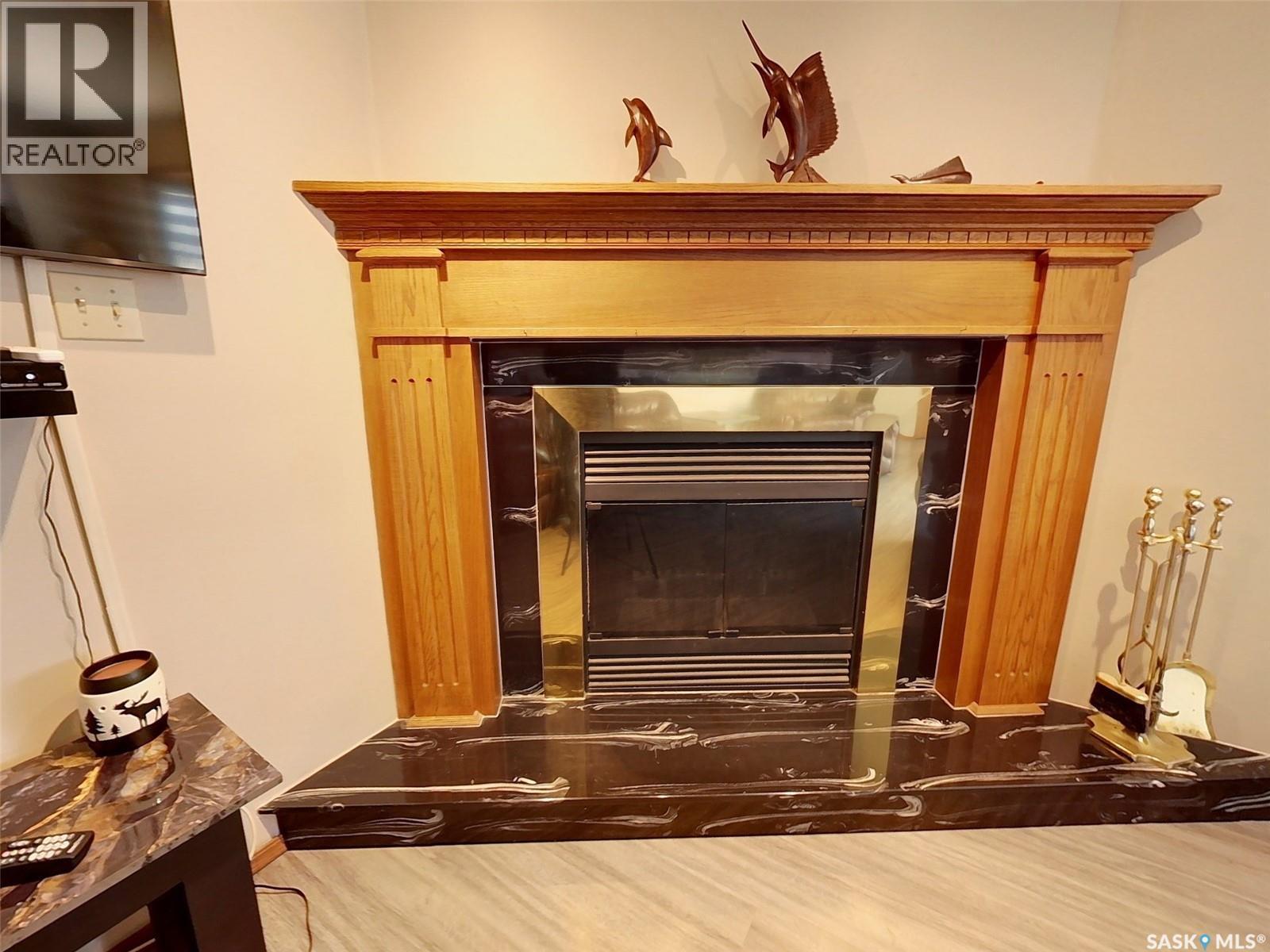 334 Young Street, Earl Grey, SK - Indoor Photo Showing Other Room With Fireplace