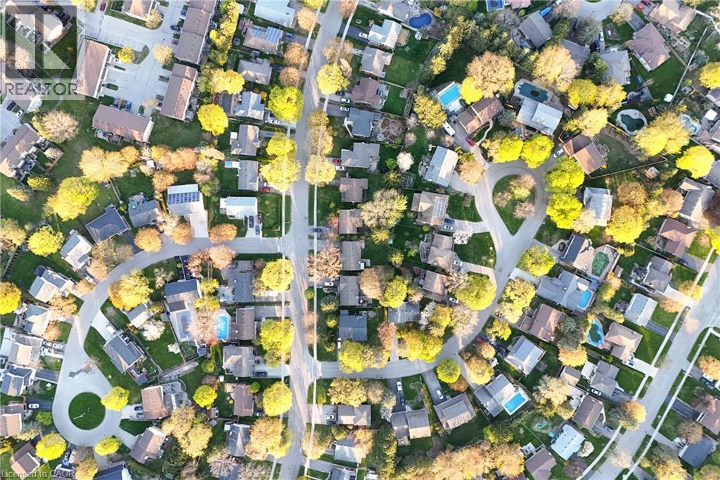 Aerial perspective of a residential community with mature trees - 183 Harvard Road, Waterloo, ON -