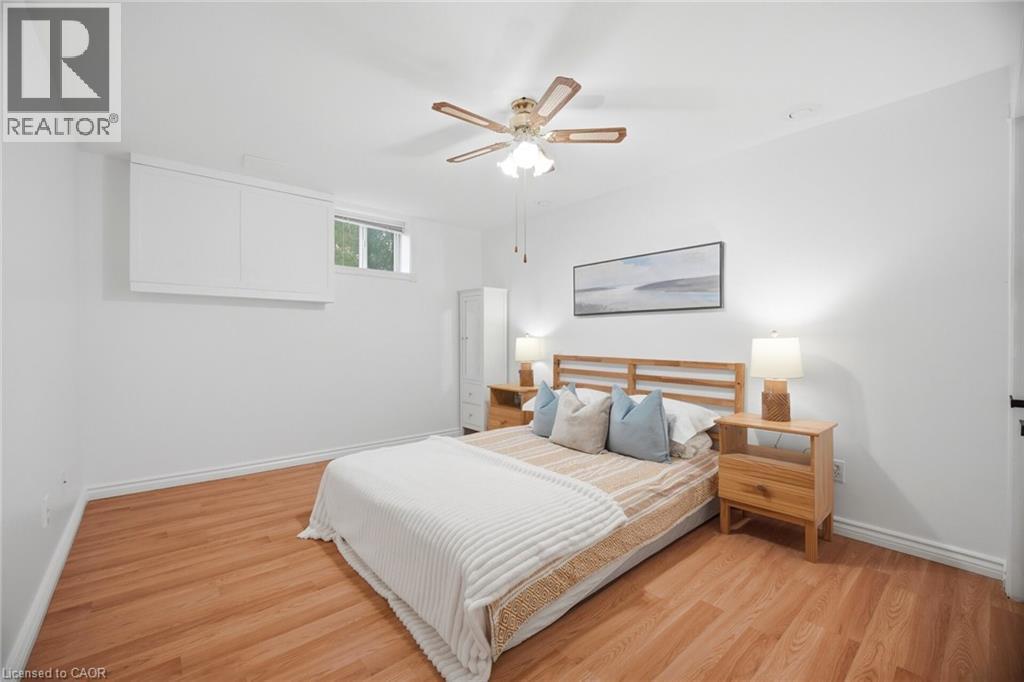 Room featuring wood-finish flooring and a ceiling fan with light fixture - 1376 Royal Drive, Burlington, ON - Indoor Photo Showing Bedroom