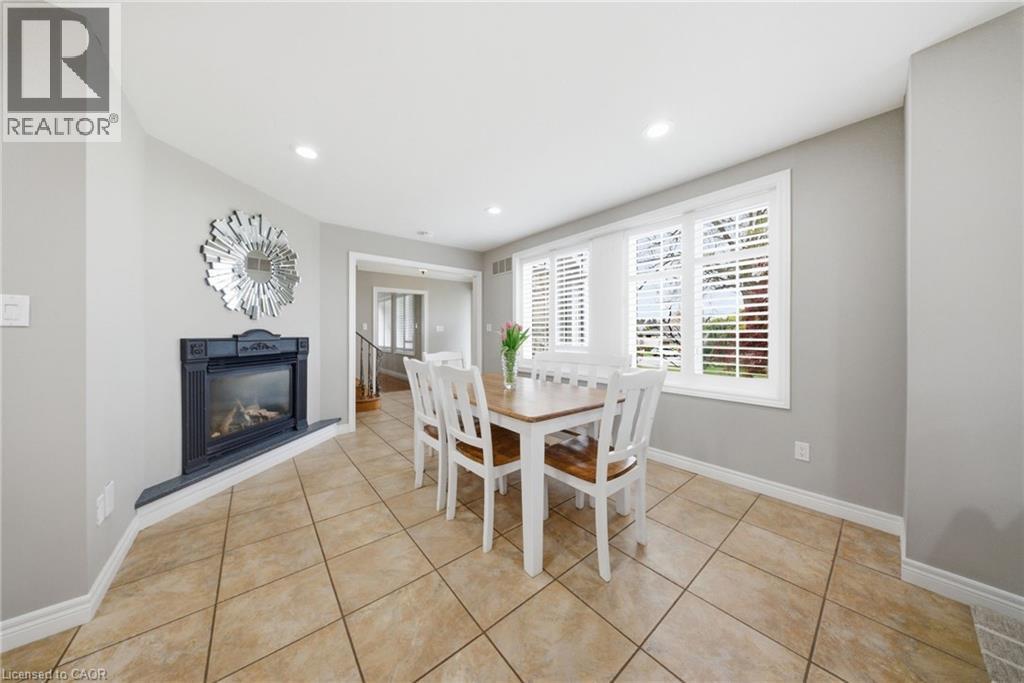 383 North Shore Boulevard W, Burlington, ON - Indoor Photo Showing Dining Room With Fireplace