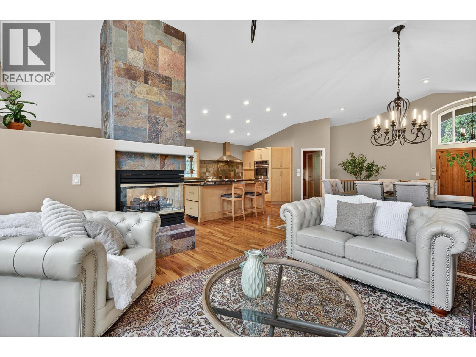 3929 Gallaghers Circle, Kelowna, BC - Indoor Photo Showing Living Room With Fireplace