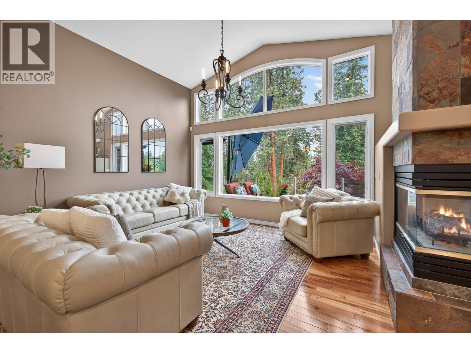 3929 Gallaghers Circle, Kelowna, BC - Indoor Photo Showing Living Room With Fireplace