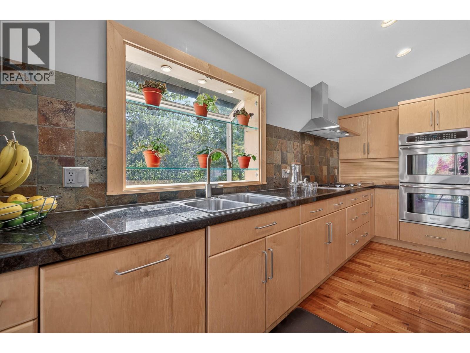 3929 Gallaghers Circle, Kelowna, BC - Indoor Photo Showing Kitchen With Double Sink