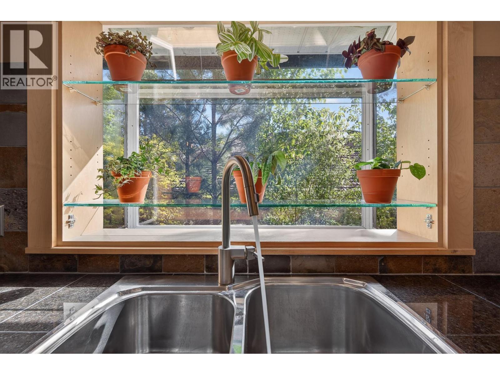 3929 Gallaghers Circle, Kelowna, BC - Indoor Photo Showing Kitchen With Double Sink
