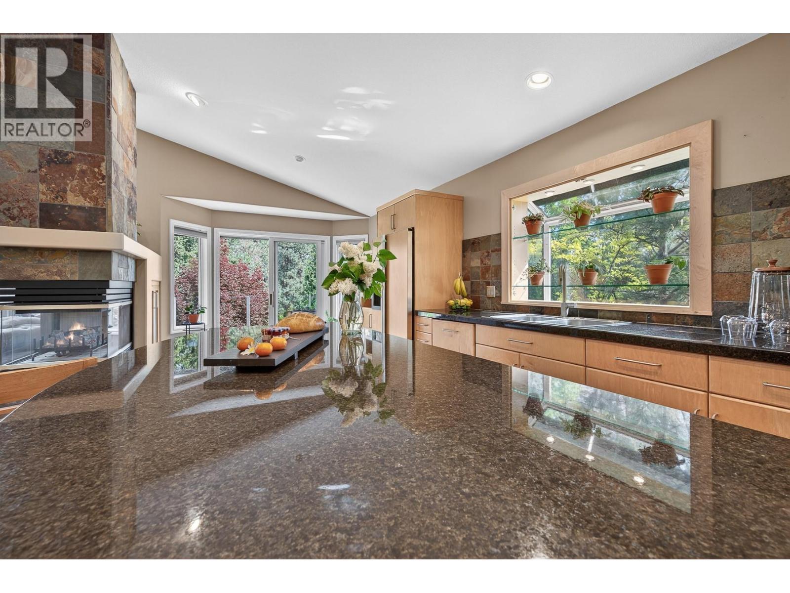 3929 Gallaghers Circle, Kelowna, BC - Indoor With Fireplace