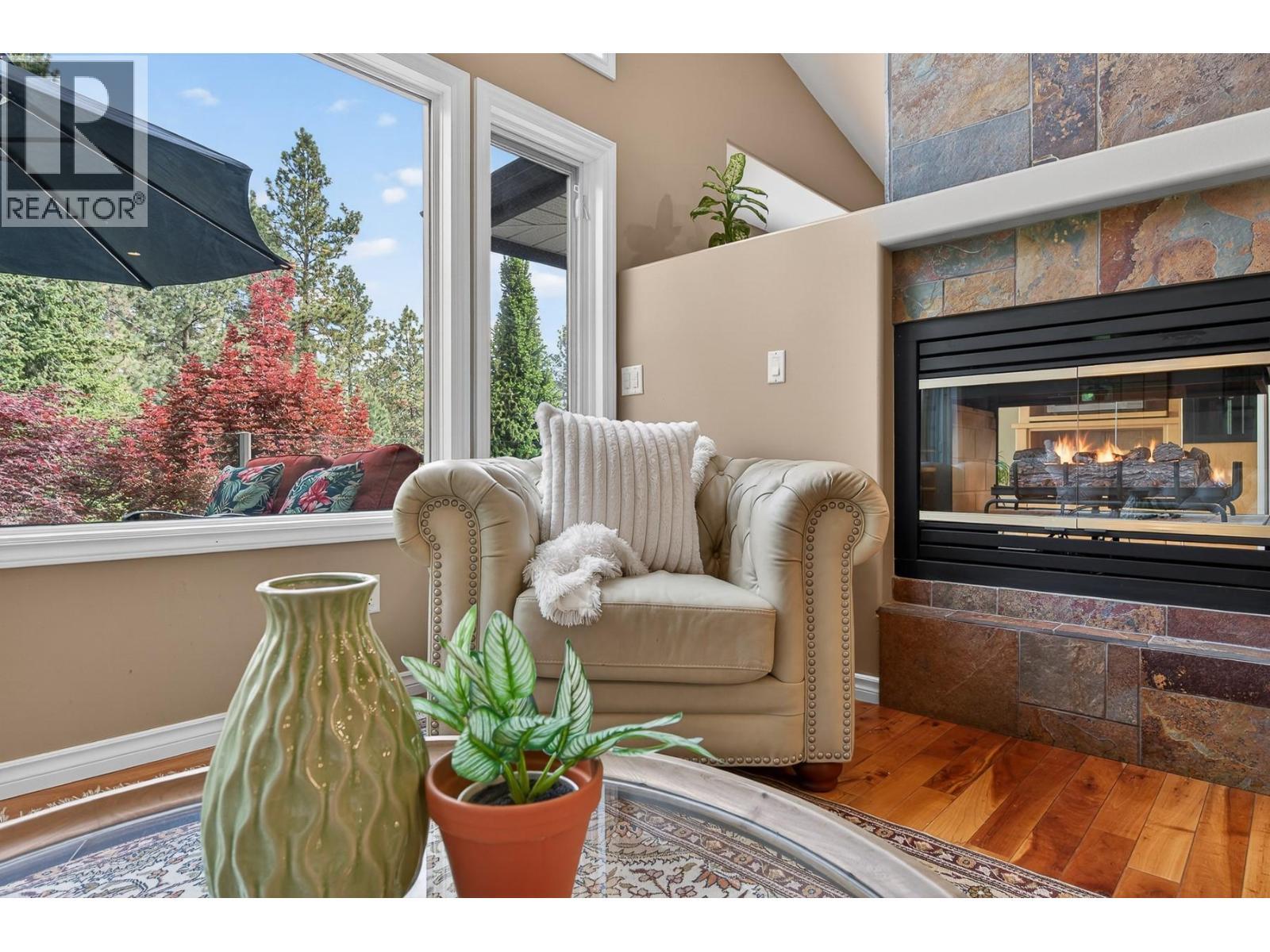 3929 Gallaghers Circle, Kelowna, BC - Indoor Photo Showing Living Room With Fireplace