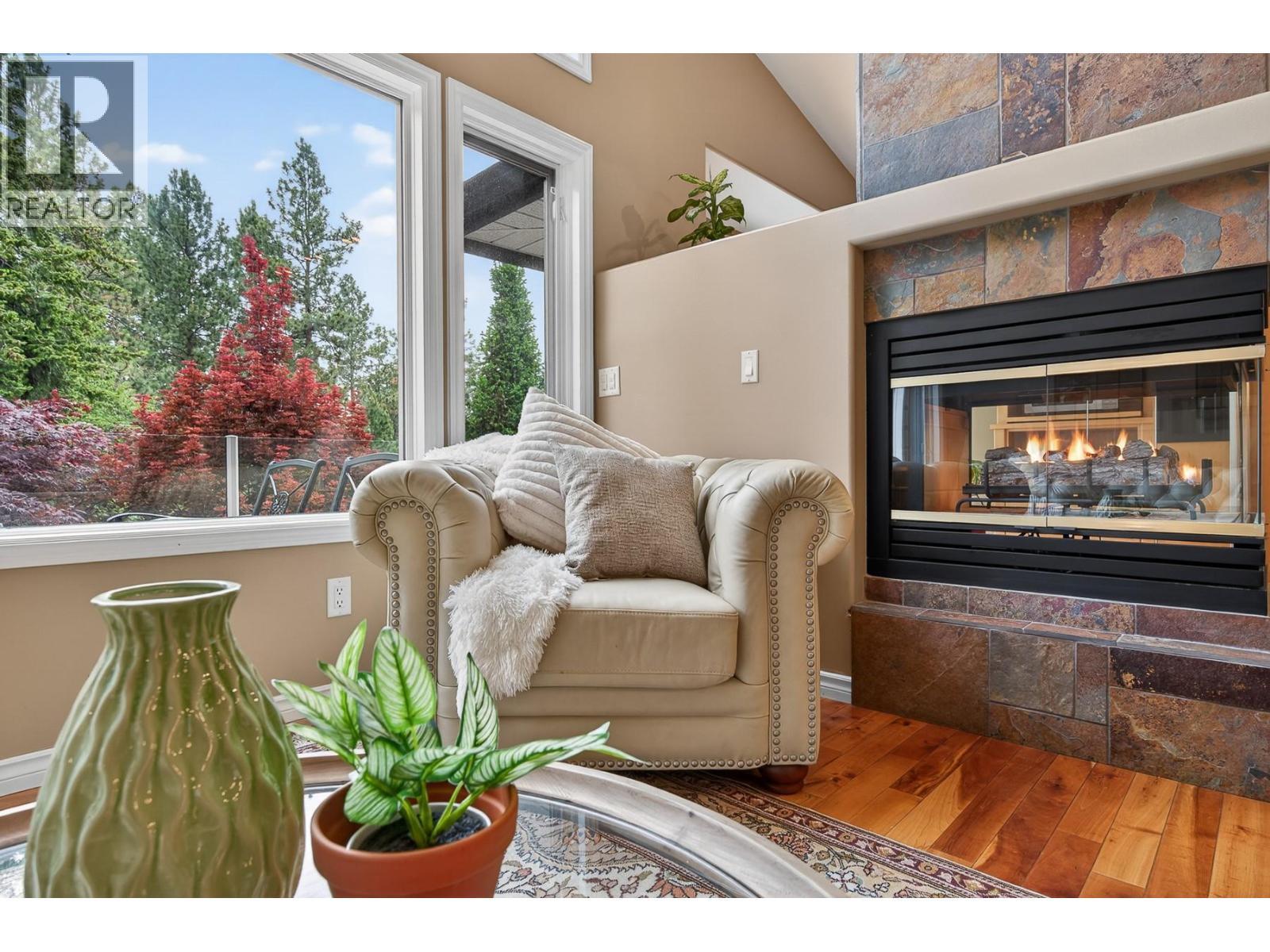 3929 Gallaghers Circle, Kelowna, BC - Indoor Photo Showing Living Room With Fireplace