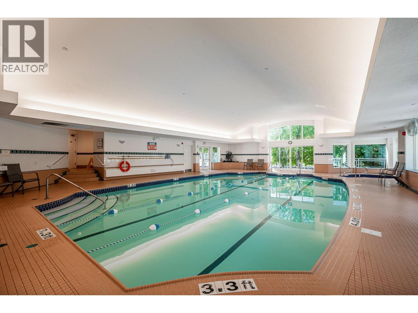 3929 Gallaghers Circle, Kelowna, BC - Indoor Photo Showing Other Room With In Ground Pool
