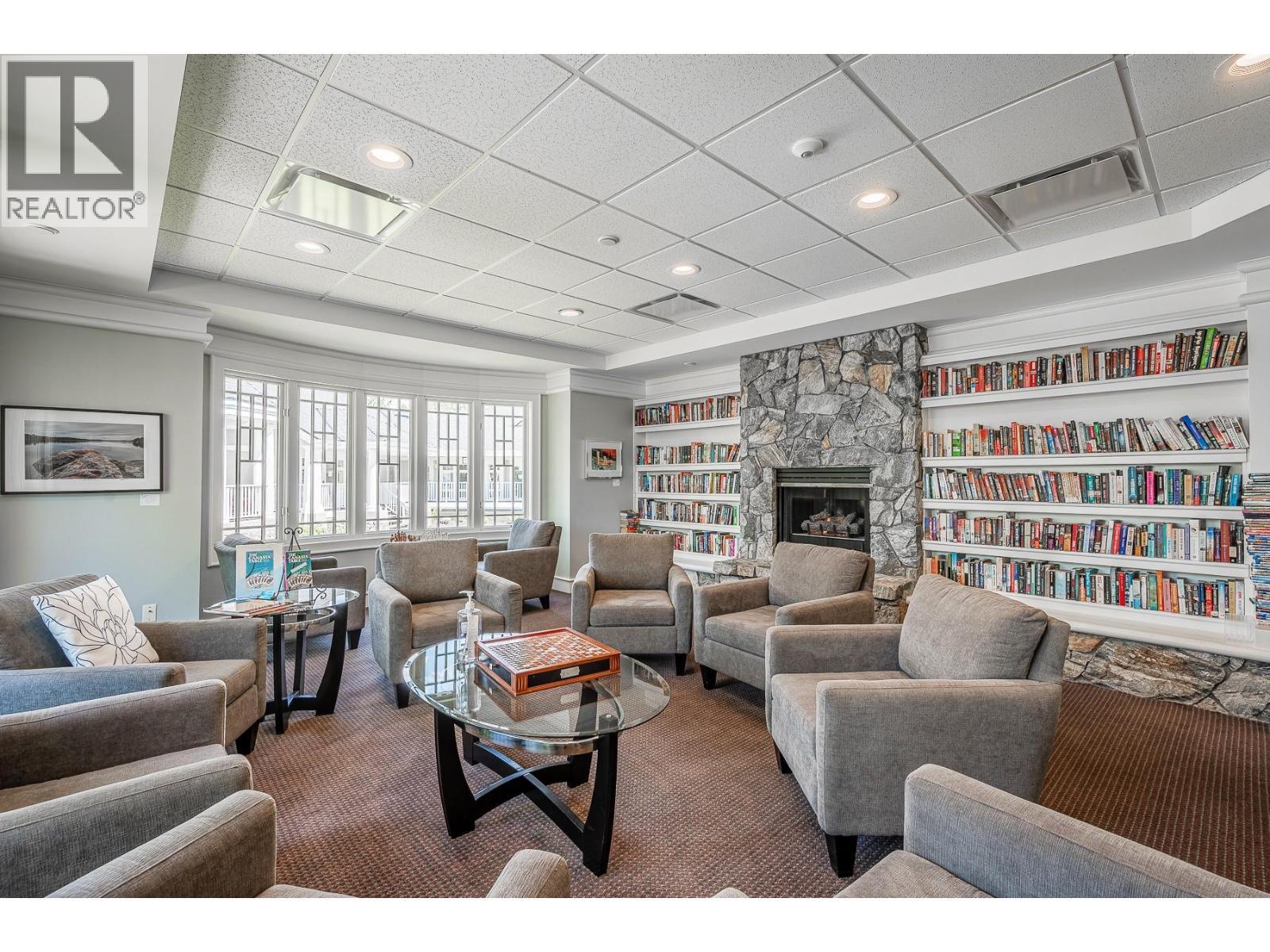3929 Gallaghers Circle, Kelowna, BC - Indoor Photo Showing Living Room With Fireplace