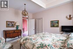 Recessed ceiling detail and wall-mounted sconces -