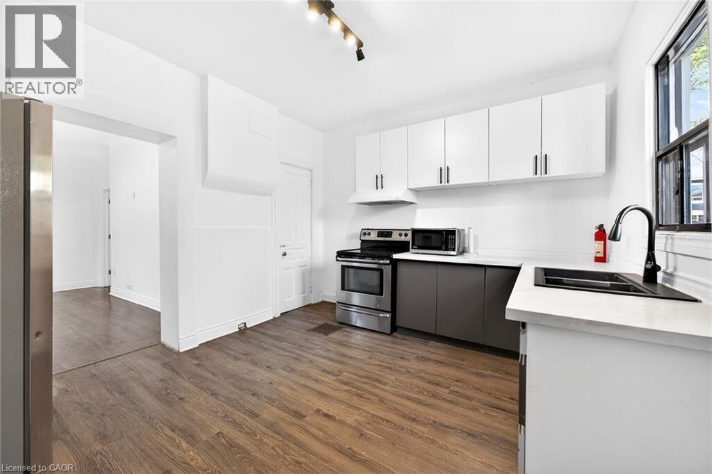 99 Leeming Street, Hamilton, ON - Indoor Photo Showing Kitchen With Double Sink