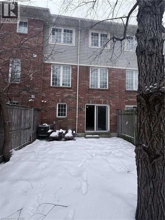 Rear exterior with red brick and horizontal siding - 50 Emick Drive, Ancaster, ON - Outdoor