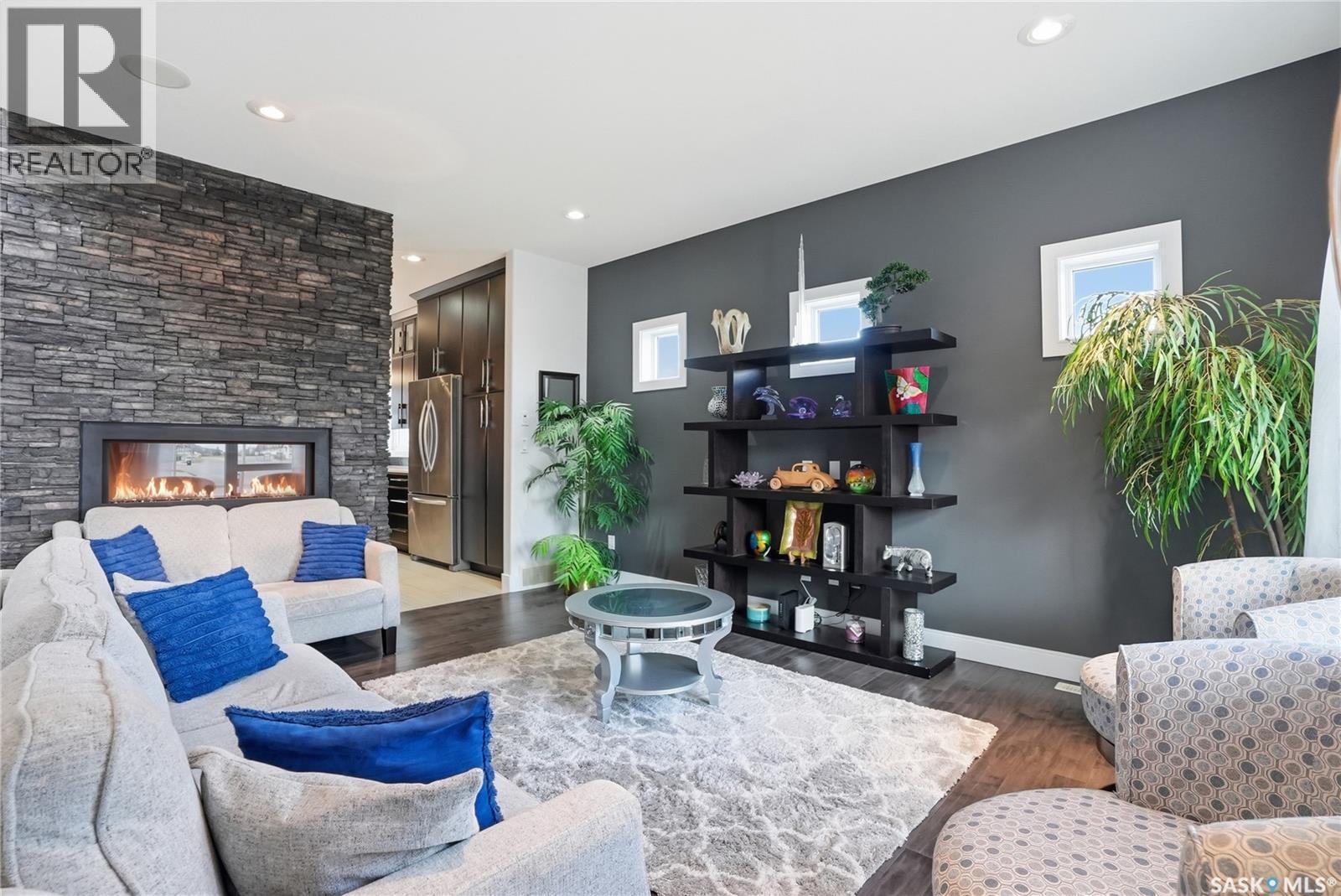 102 Teal Crescent, Saskatoon, SK - Indoor Photo Showing Living Room With Fireplace