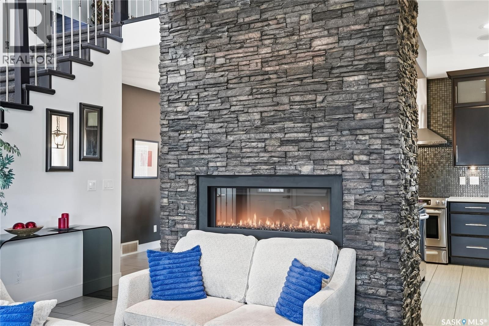 102 Teal Crescent, Saskatoon, SK - Indoor Photo Showing Living Room With Fireplace