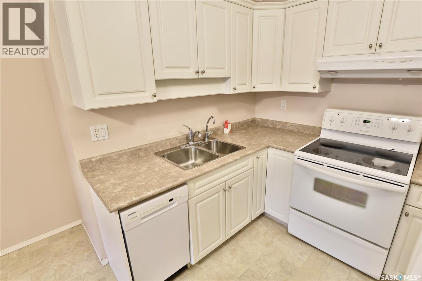 220 Cedar Meadow Drive, Regina, SK - Indoor Photo Showing Kitchen With Double Sink