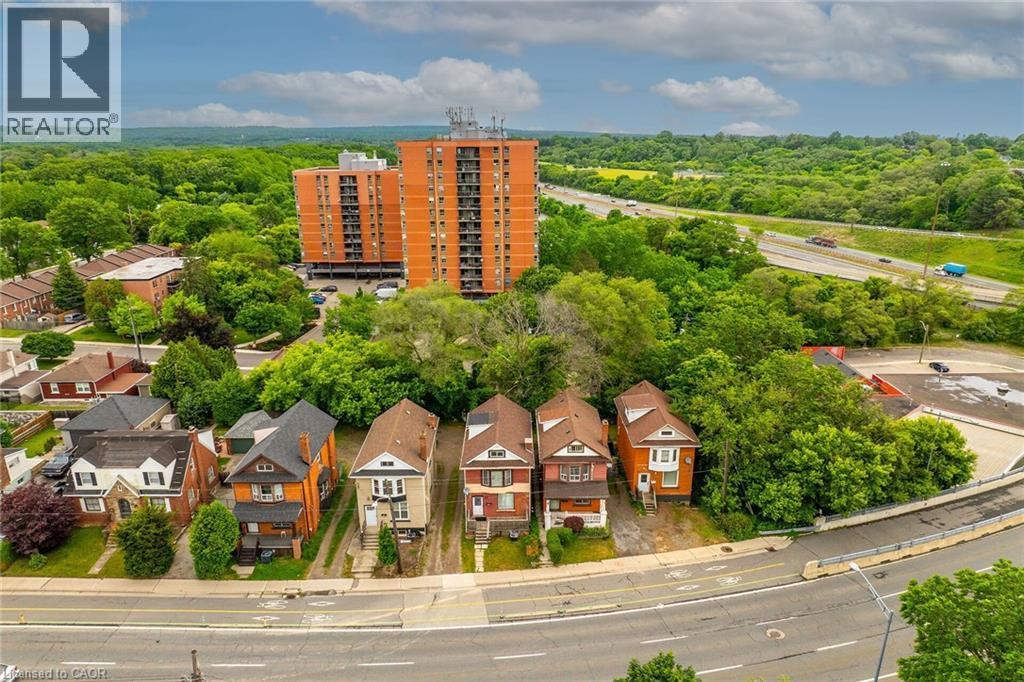 Aerial perspective showcasing residential properties surrounded by mature trees - 738 King Street W, Hamilton, ON - Outdoor With View