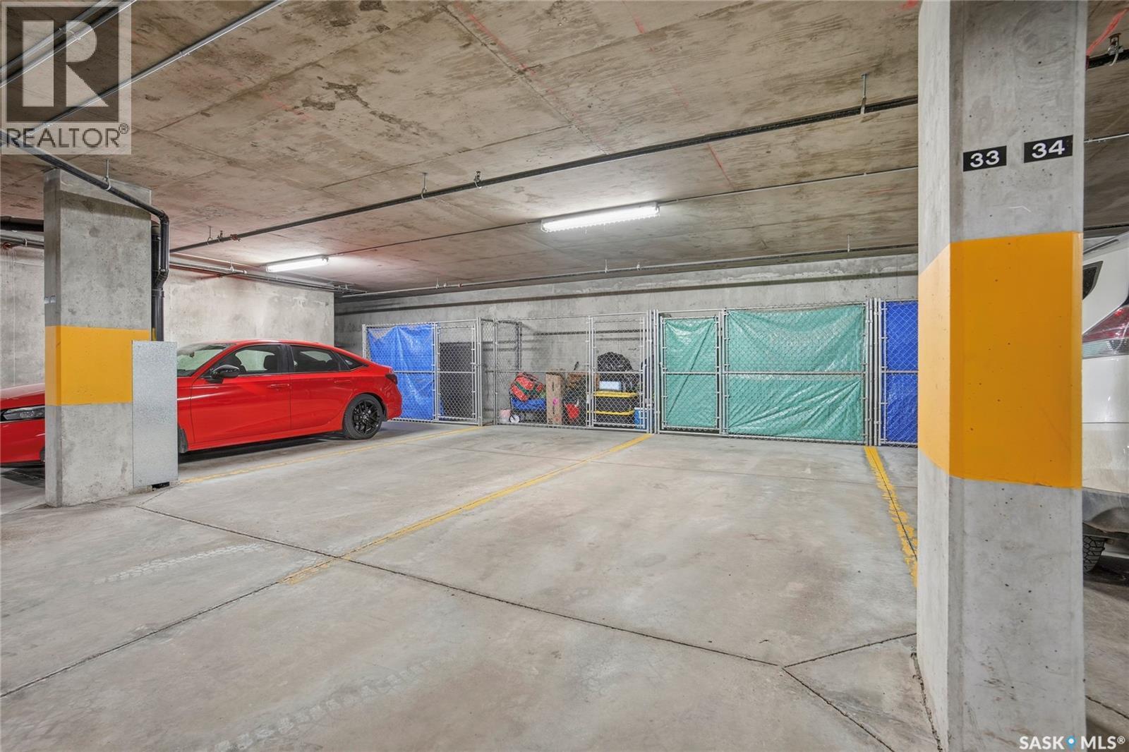 212 235 Evergreen Square, Saskatoon, SK - Indoor Photo Showing Garage