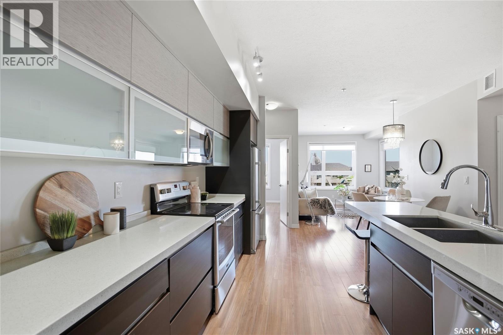 212 235 Evergreen Square, Saskatoon, SK - Indoor Photo Showing Kitchen With Double Sink With Upgraded Kitchen