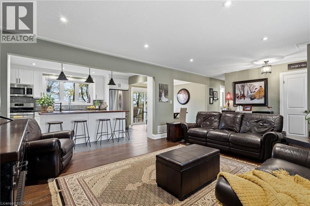 Spacious living area featuring wood-finish flooring and recessed lighting - 2116 Binbrook Road E, Hamilton, ON - Indoor Photo Showing Living Room