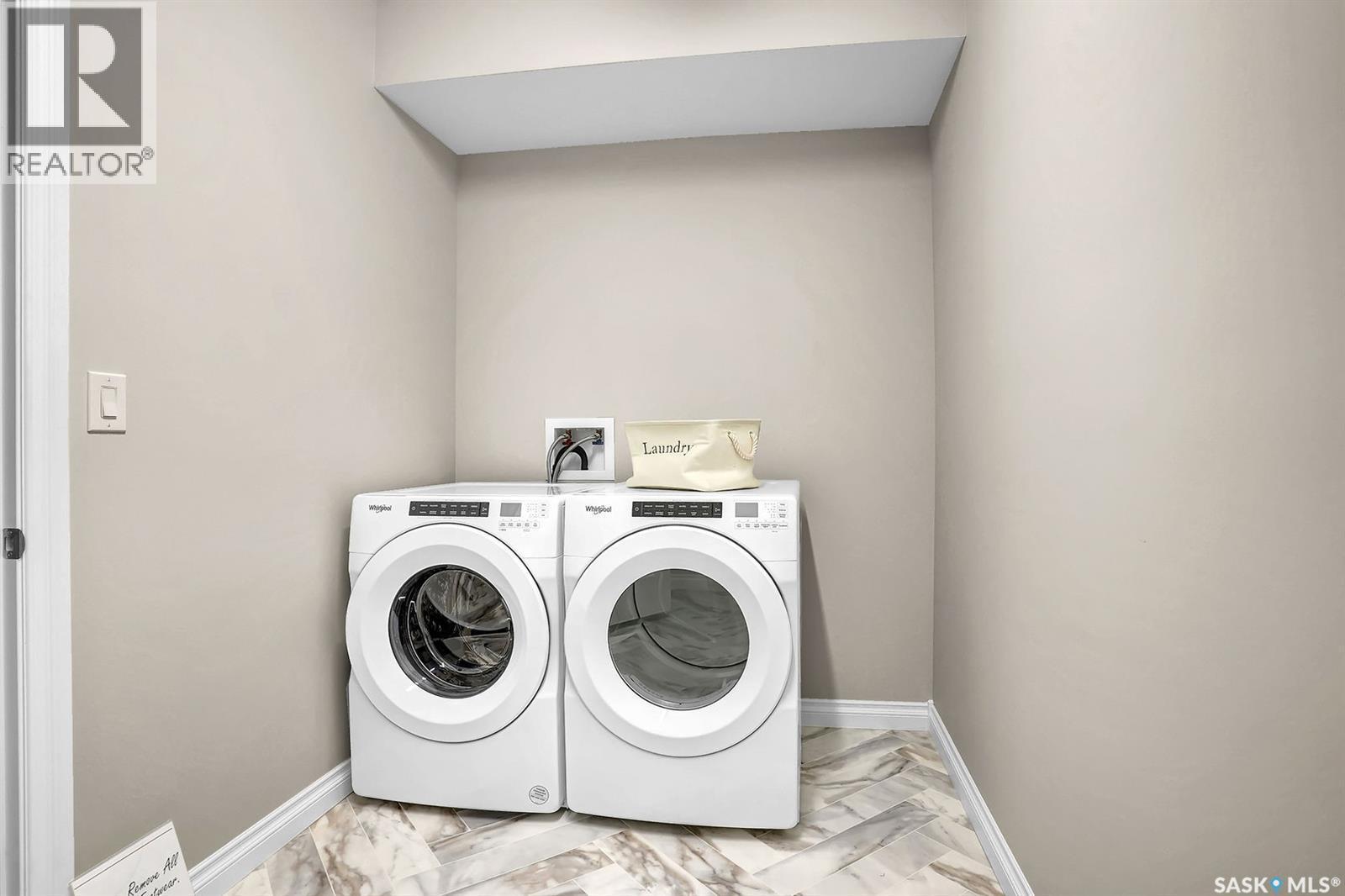 401 4594 Harbour Landing Drive, Regina, SK - Indoor Photo Showing Laundry Room
