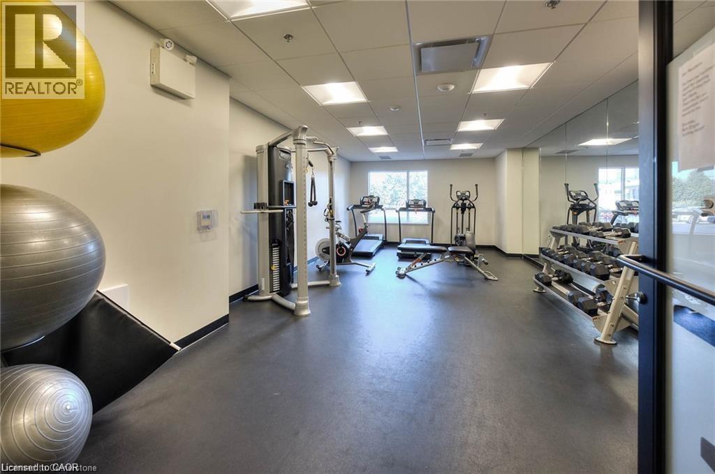 Fitness room. - 247 Northfield Drive E Unit# 207, Waterloo, ON - Indoor Photo Showing Gym Room