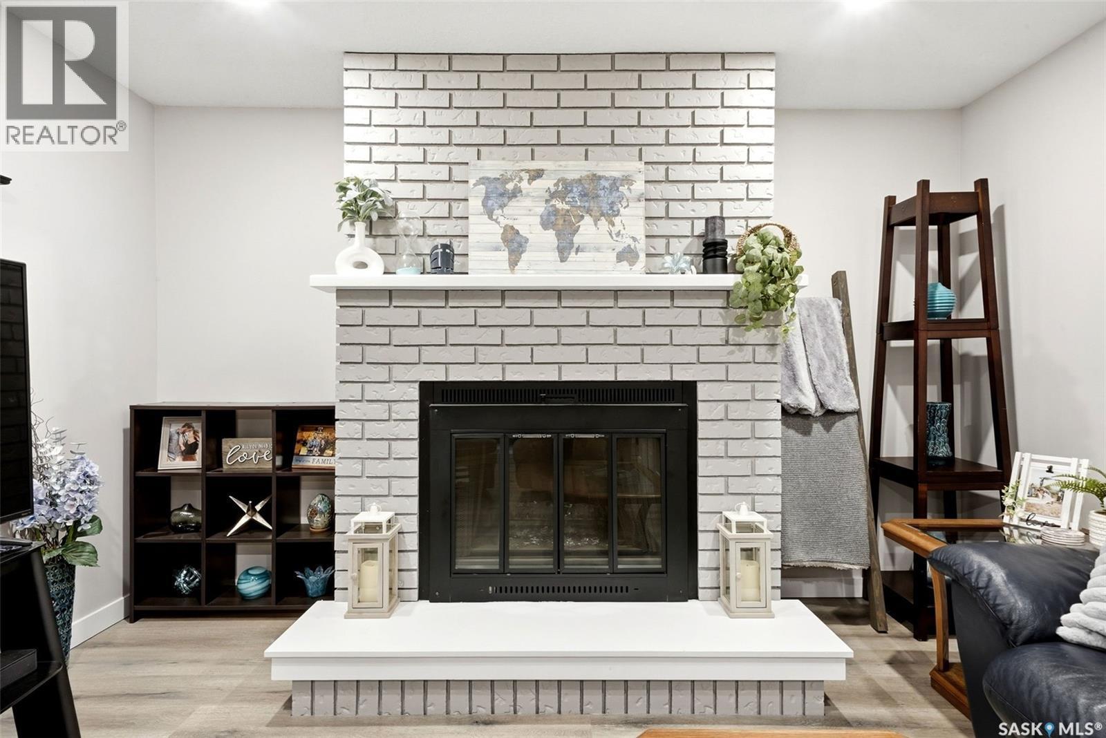 68 Carmichael Road, Regina, SK - Indoor Photo Showing Living Room With Fireplace
