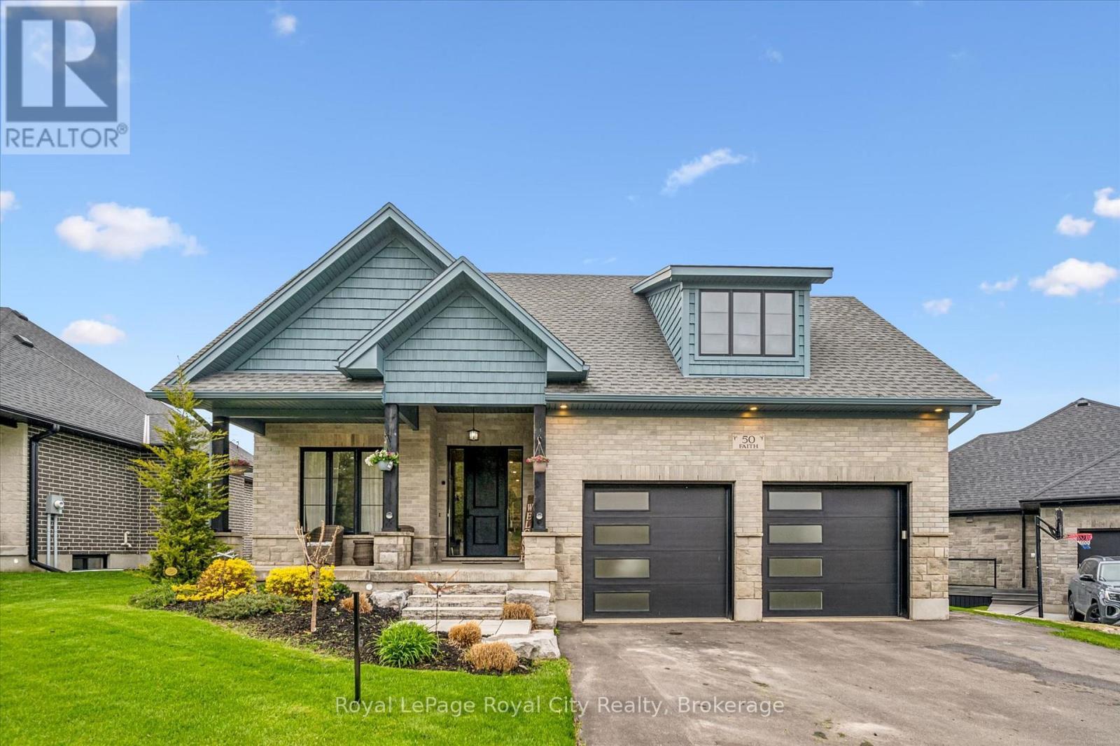 50 Faith Drive, Mapleton, ON - Outdoor With Deck Patio Veranda With Facade