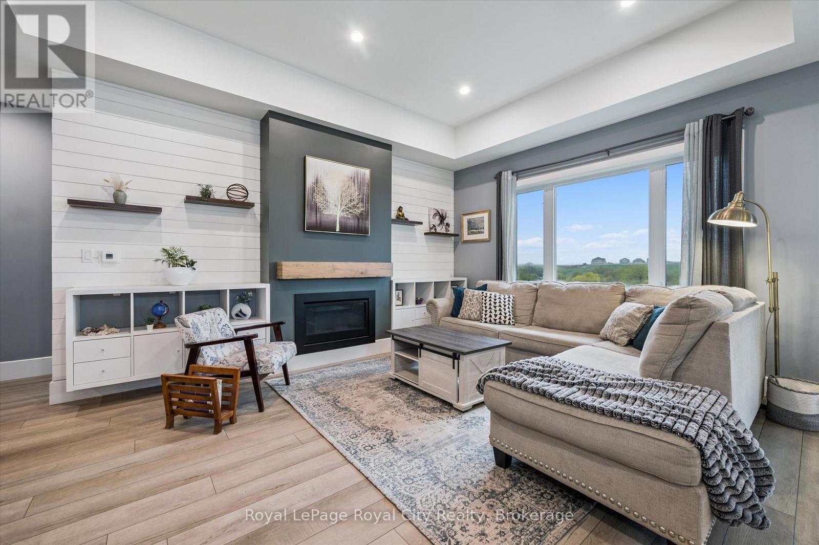 50 Faith Drive, Mapleton, ON - Indoor Photo Showing Living Room With Fireplace