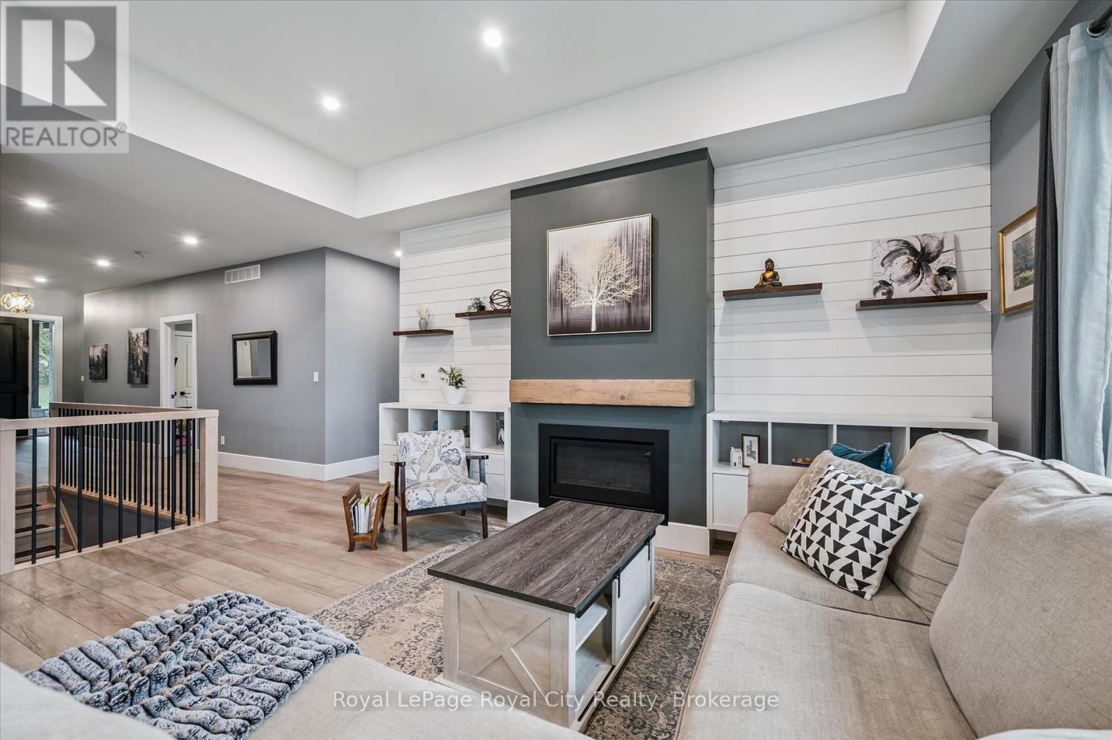 50 Faith Drive, Mapleton, ON - Indoor Photo Showing Living Room With Fireplace