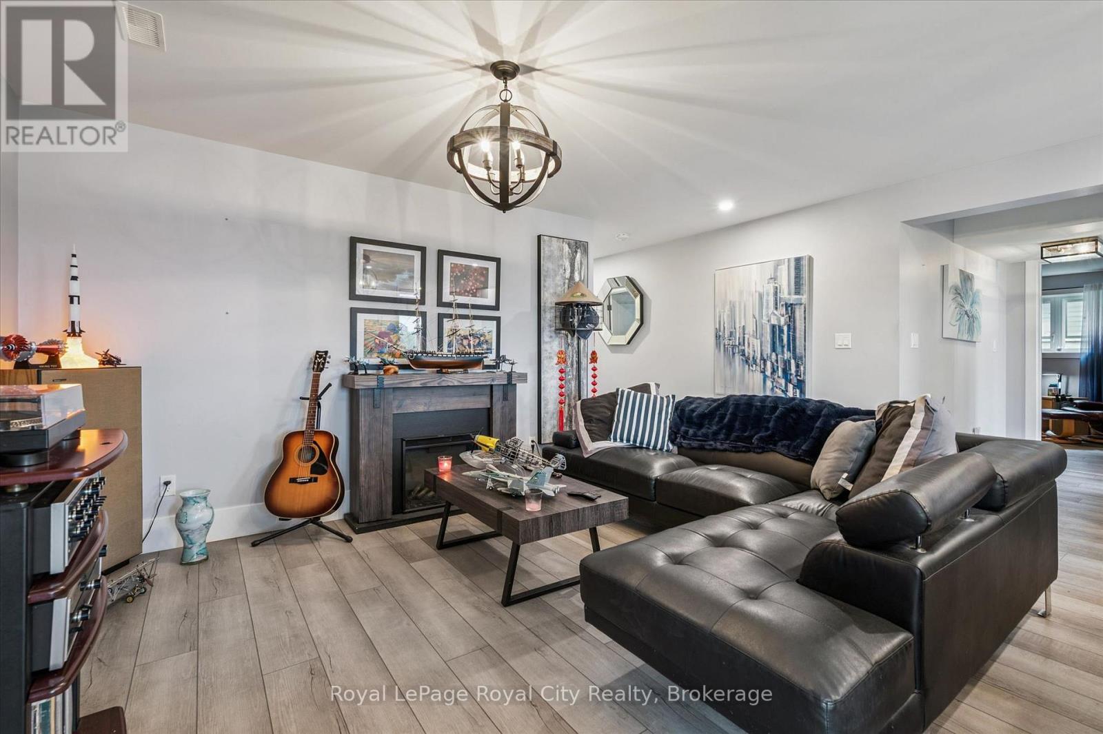 50 Faith Drive, Mapleton, ON - Indoor Photo Showing Living Room With Fireplace