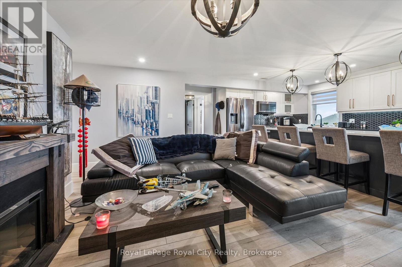 50 Faith Drive, Mapleton, ON - Indoor Photo Showing Living Room With Fireplace