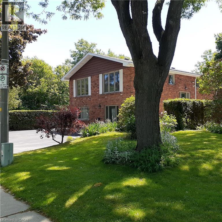 Brick exterior with white trim windows and a brown gable accent - 3 San Pedro Drive, Hamilton, ON - Outdoor