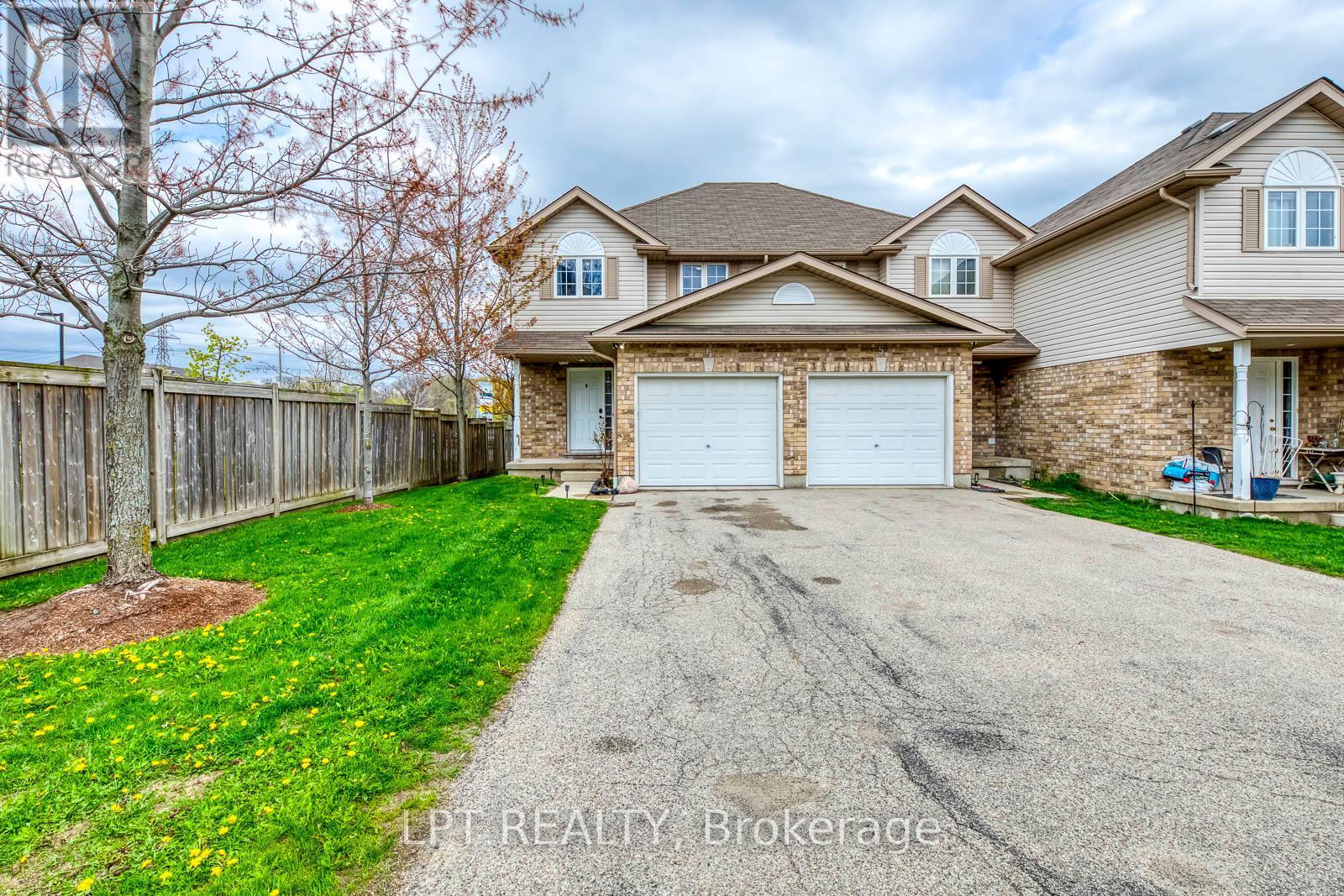 2 Cars driveway in front of Garage - 6 - 10 Fallowfield Drive, Kitchener, ON - Outdoor