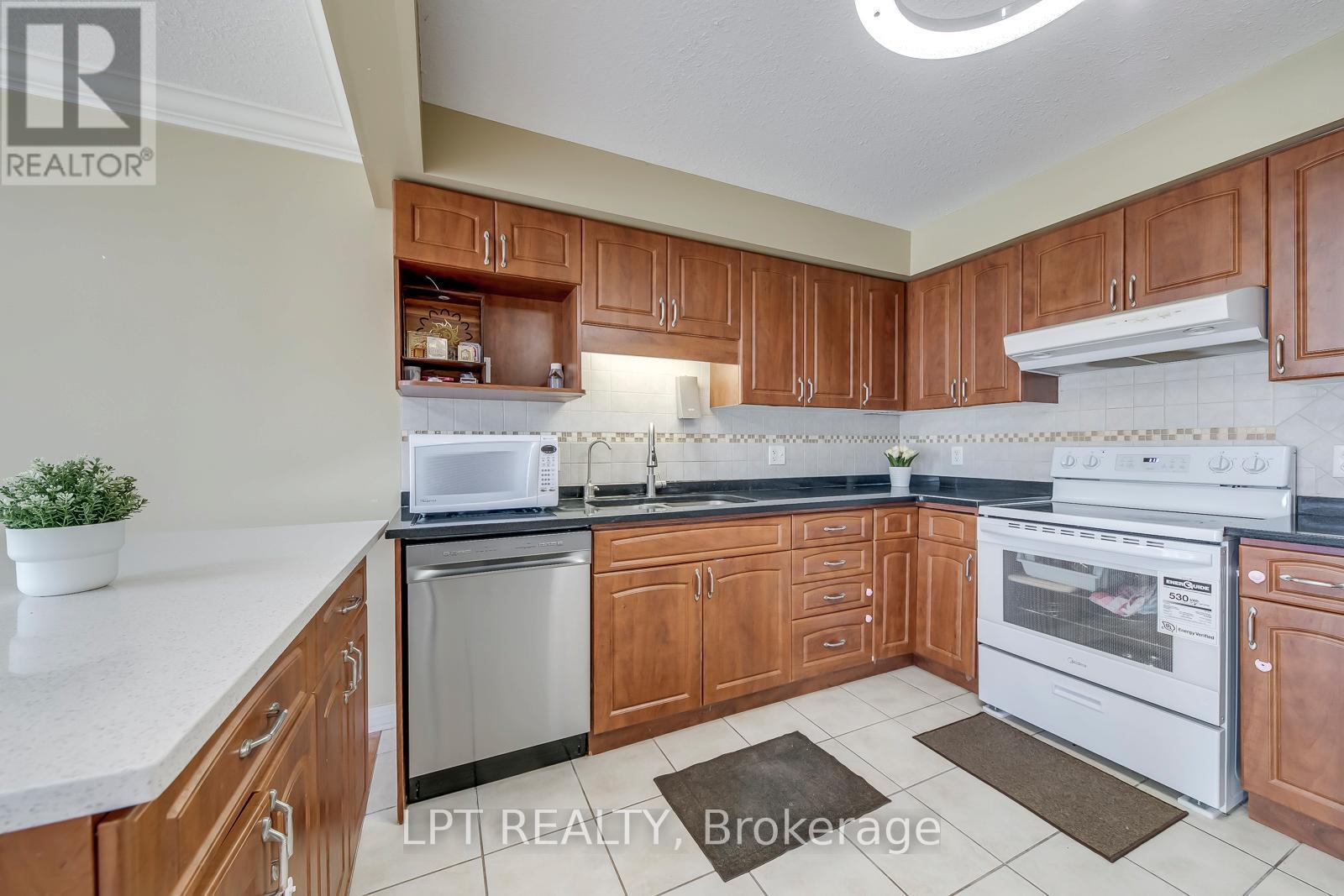 New dishwasher, new stove - 6 - 10 Fallowfield Drive, Kitchener, ON - Indoor Photo Showing Kitchen With Double Sink