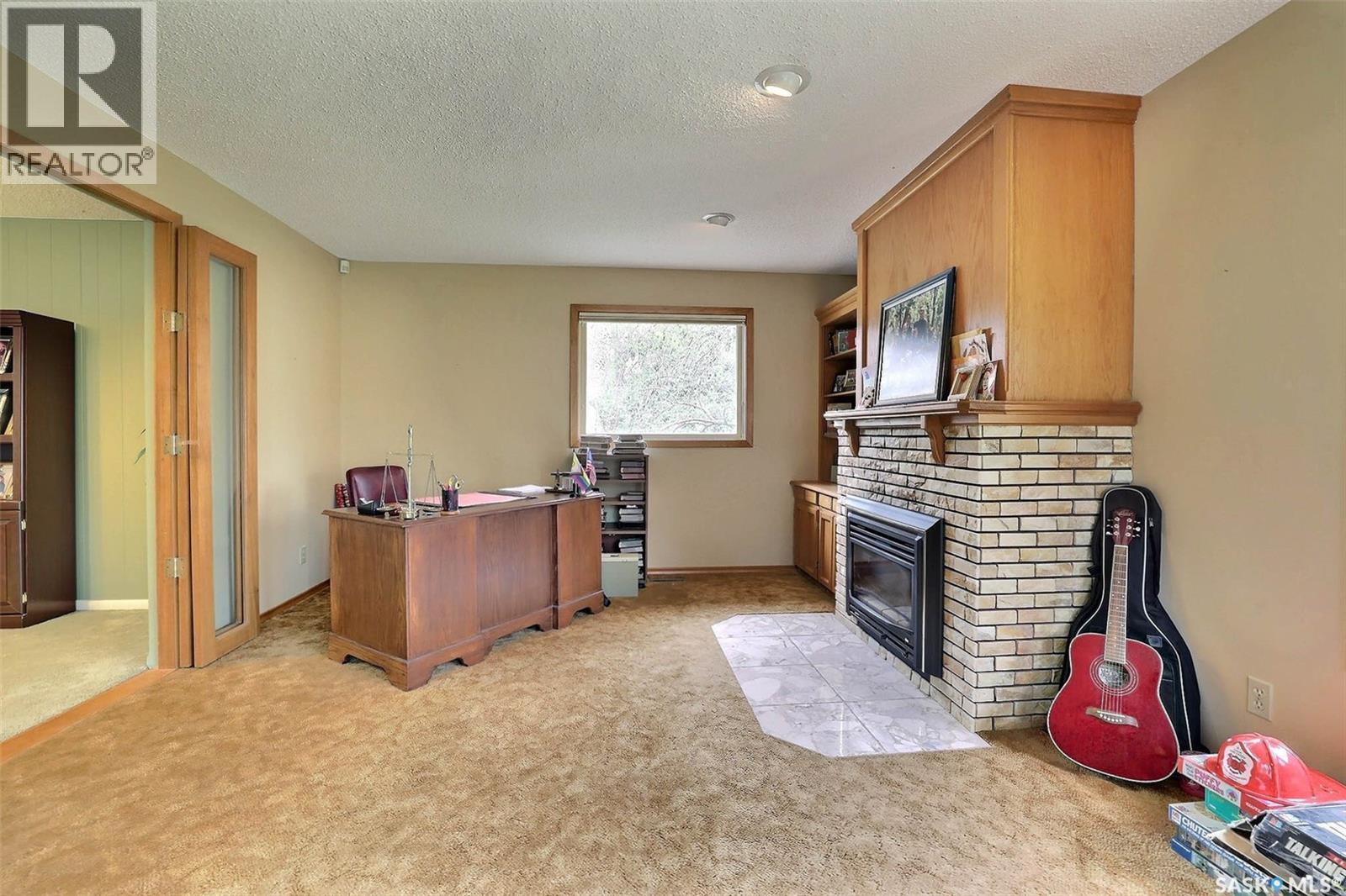 15 Academy Park Road, Regina, SK - Indoor With Fireplace