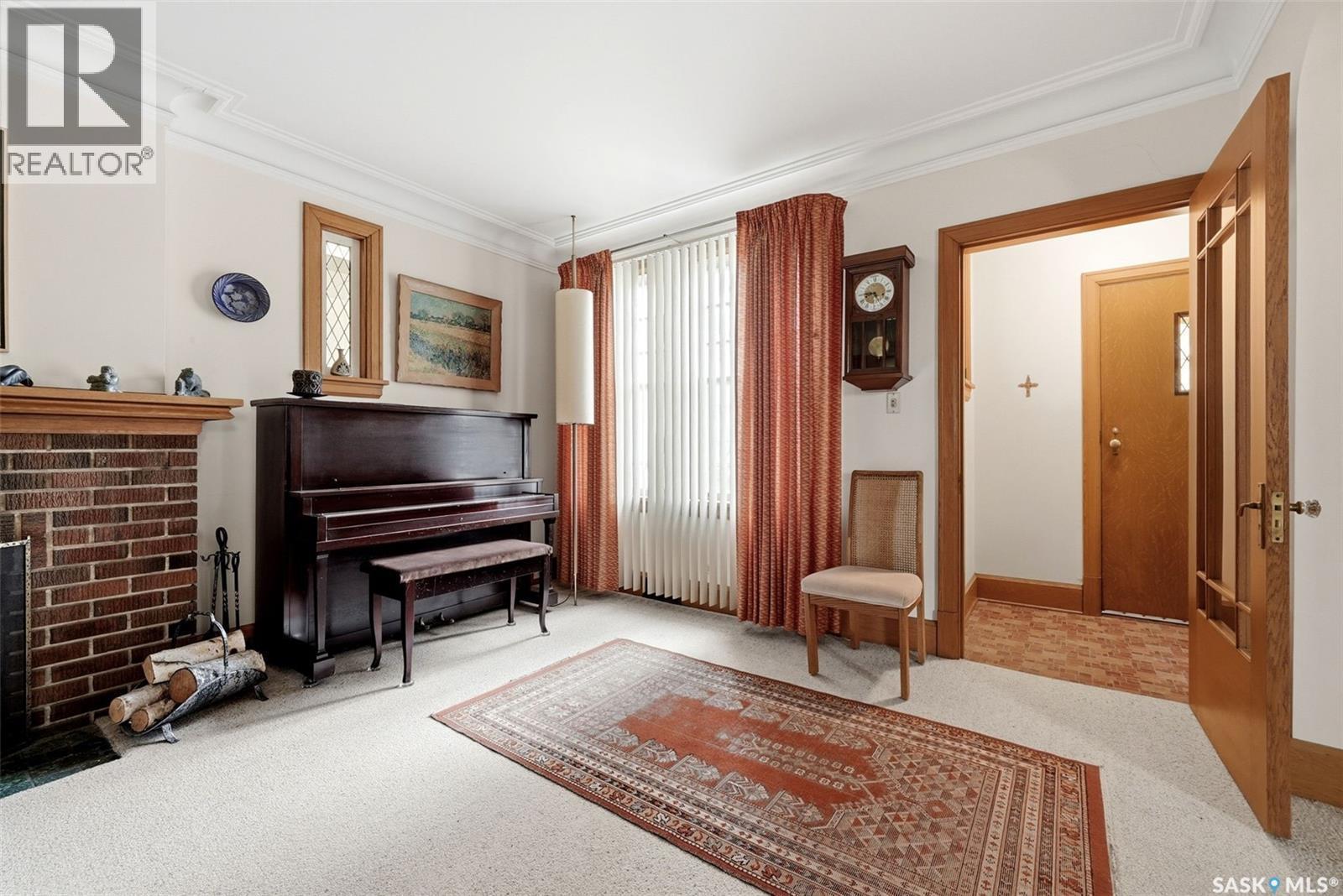 203 Angus Crescent, Regina, SK - Indoor With Fireplace