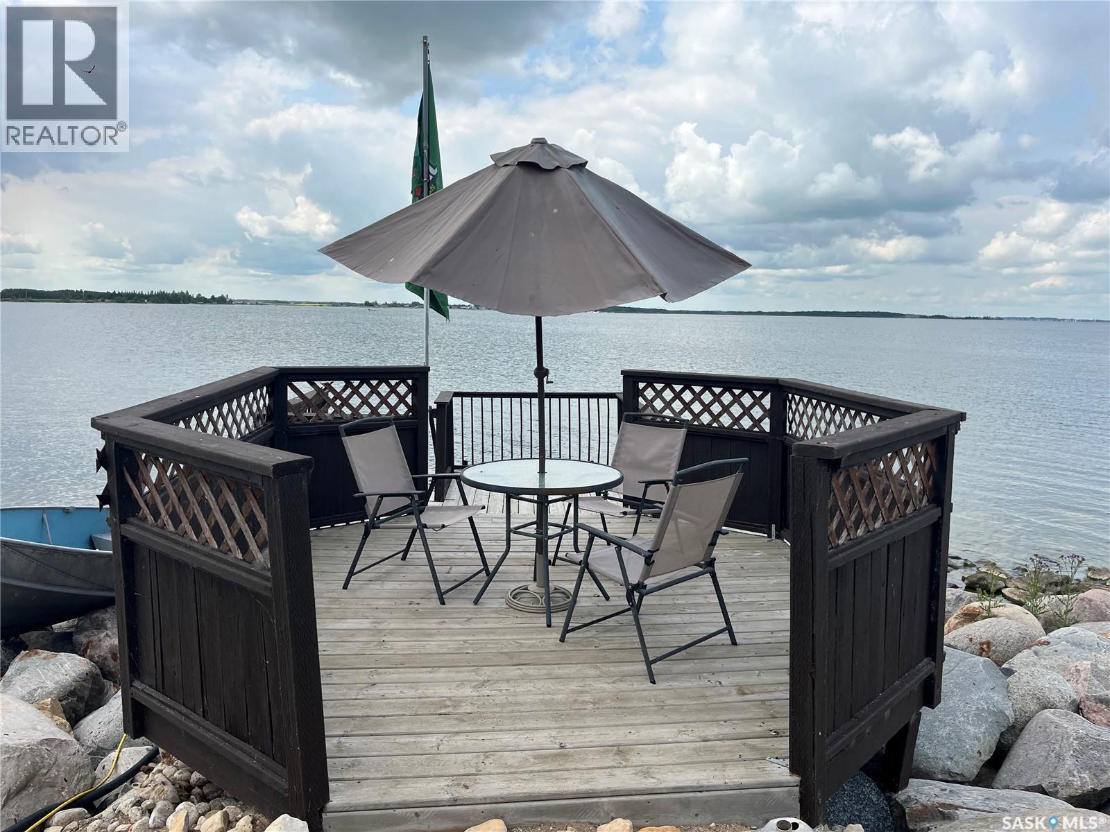 104 Heistad Place, Fishing Lake, SK - Outdoor With Body Of Water With Deck Patio Veranda With Exterior