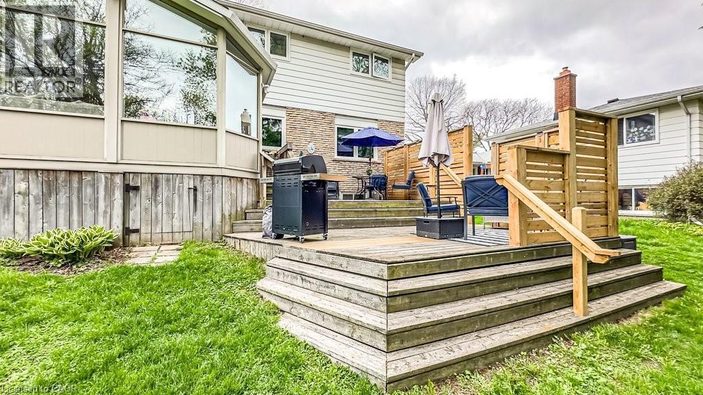 Multi-level wood deck featuring a privacy screen and integrated steps - 19 Chateau Court, Hamilton, ON - Outdoor With Deck Patio Veranda