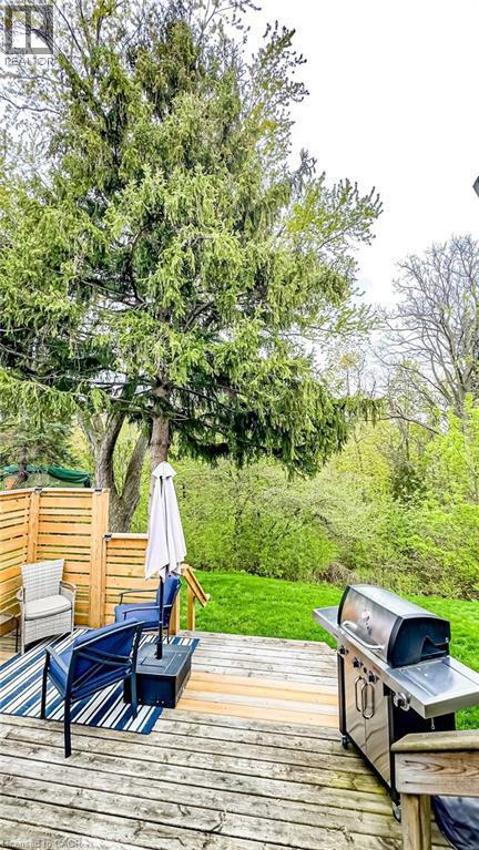 Expansive wood deck with a privacy fence and abundant mature trees - 19 Chateau Court, Hamilton, ON - Outdoor With Deck Patio Veranda