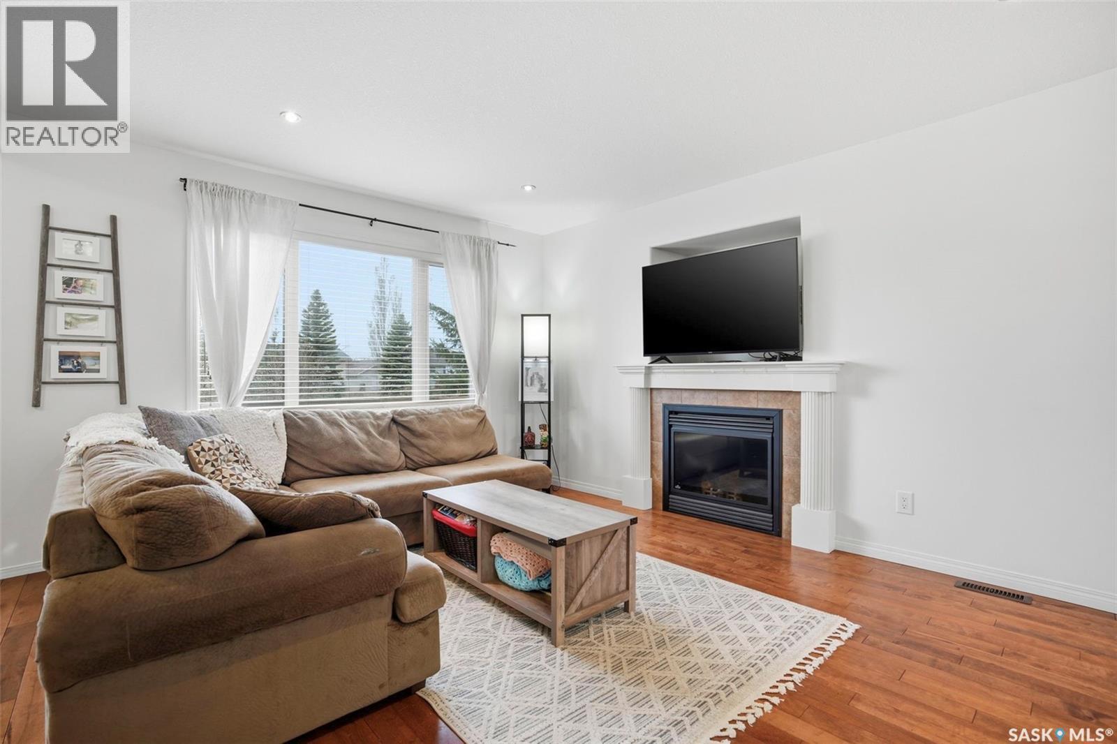 21 1600 Muzzy Drive, Prince Albert, SK - Indoor Photo Showing Living Room With Fireplace