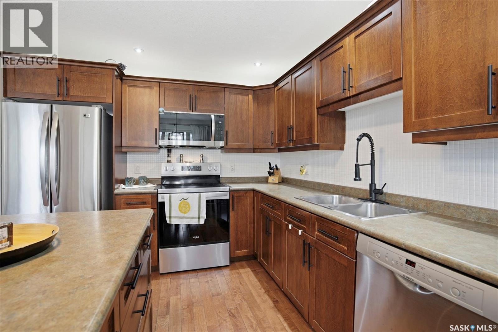 21 1600 Muzzy Drive, Prince Albert, SK - Indoor Photo Showing Kitchen With Double Sink
